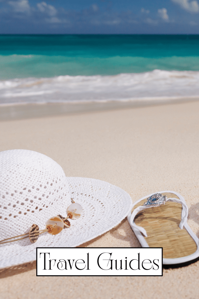 white hat and a sandal on sand next to sea