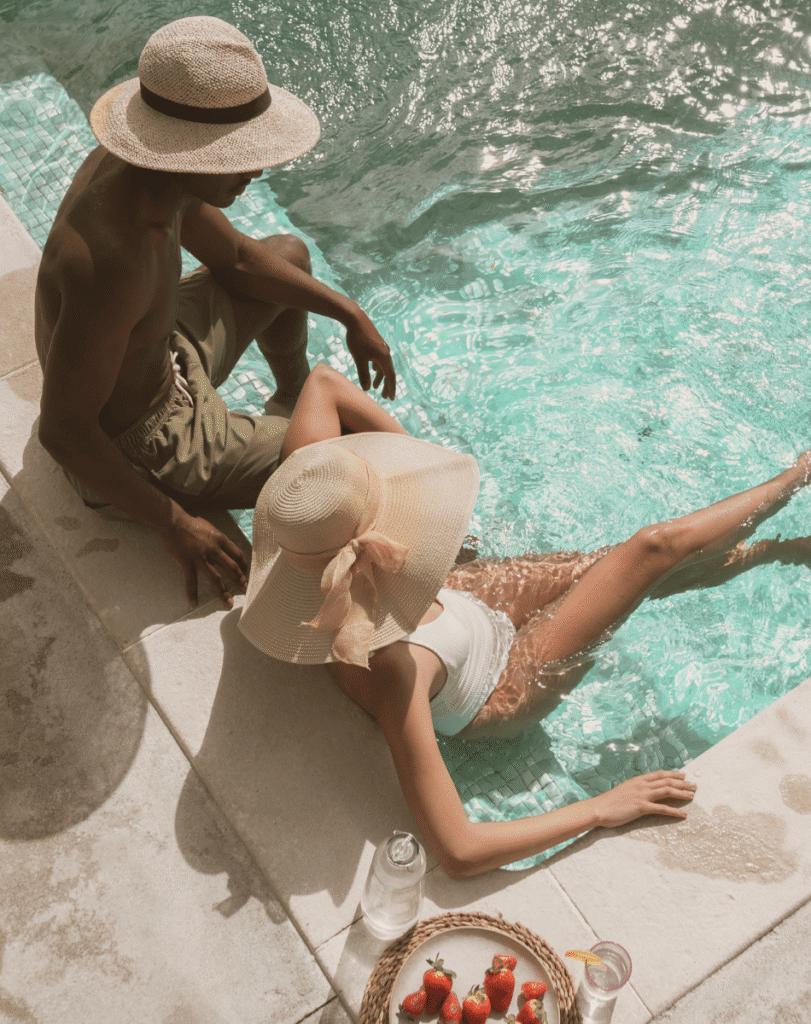 couple sitting by pool
